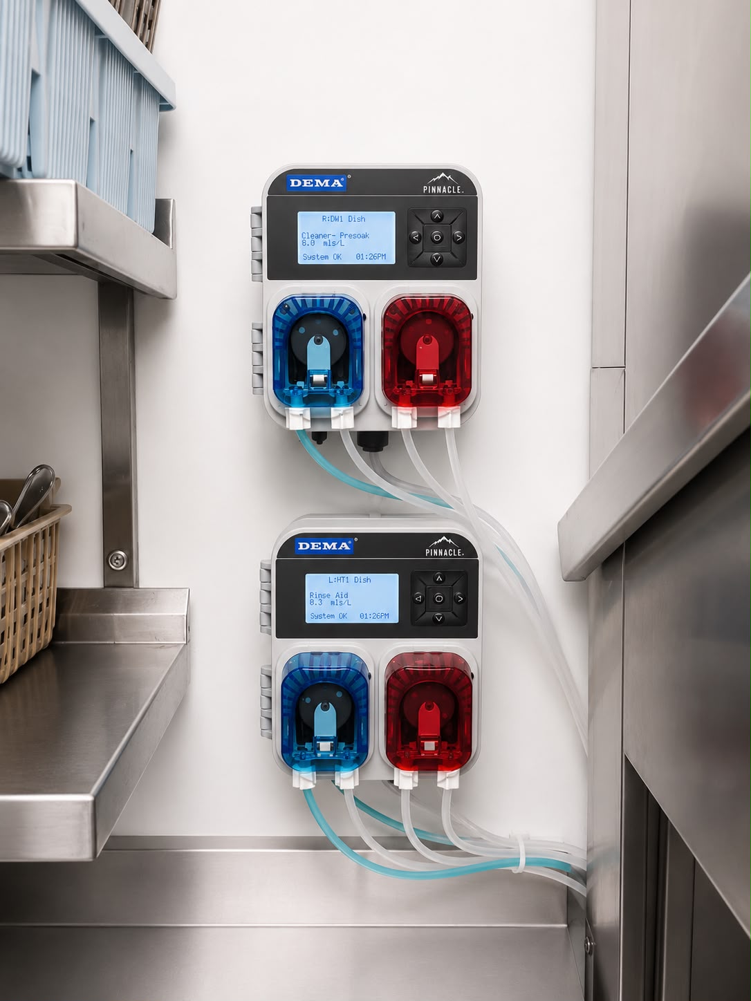 Two Cleaner Future precision warewash dosing units on a commercial kitchen wall, showing live dose rates
